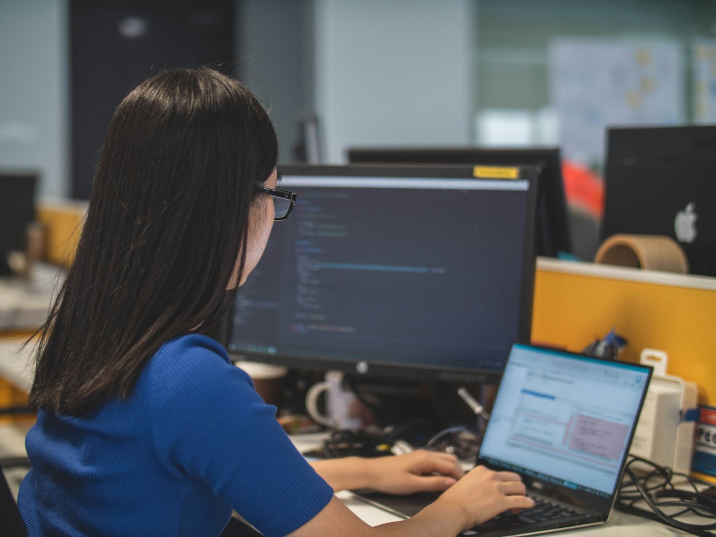 A team member updating staff records in a cloud HR system
